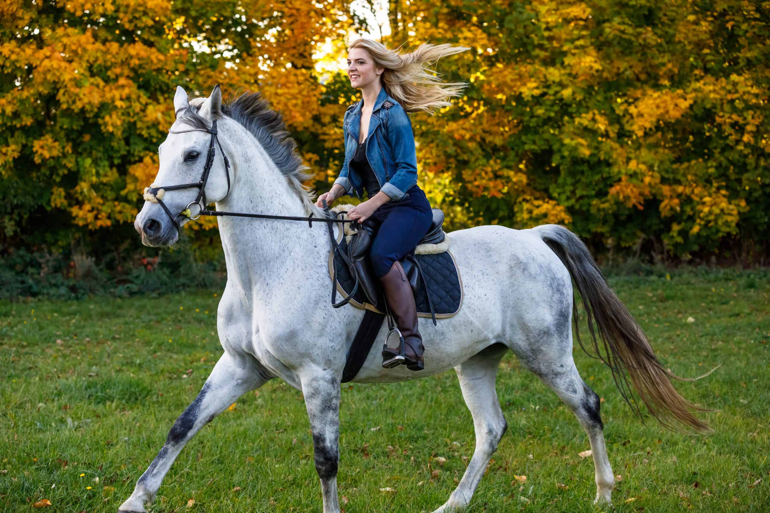 Woman riding a horse in park