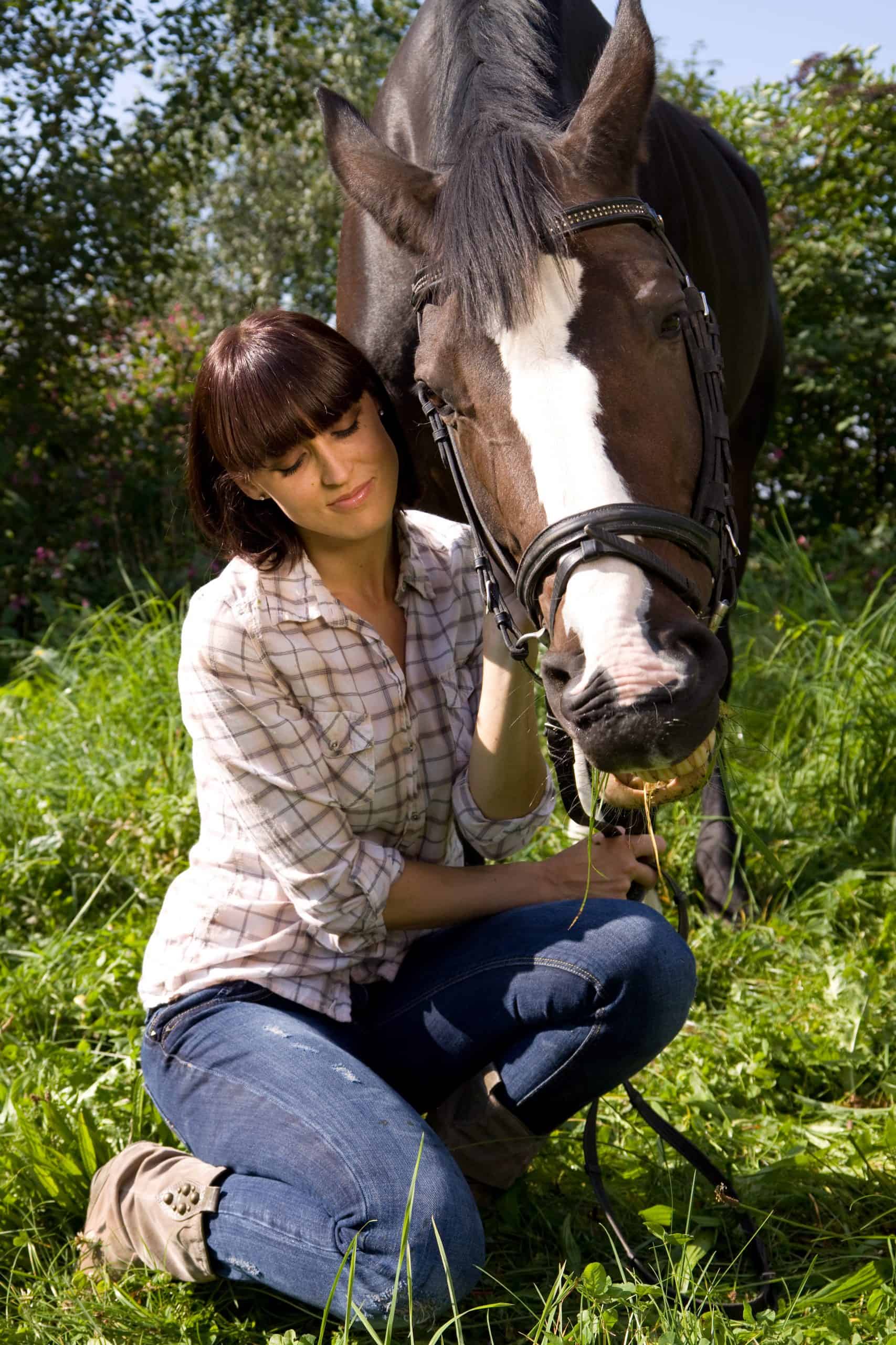 woman beside her funny looking mare
