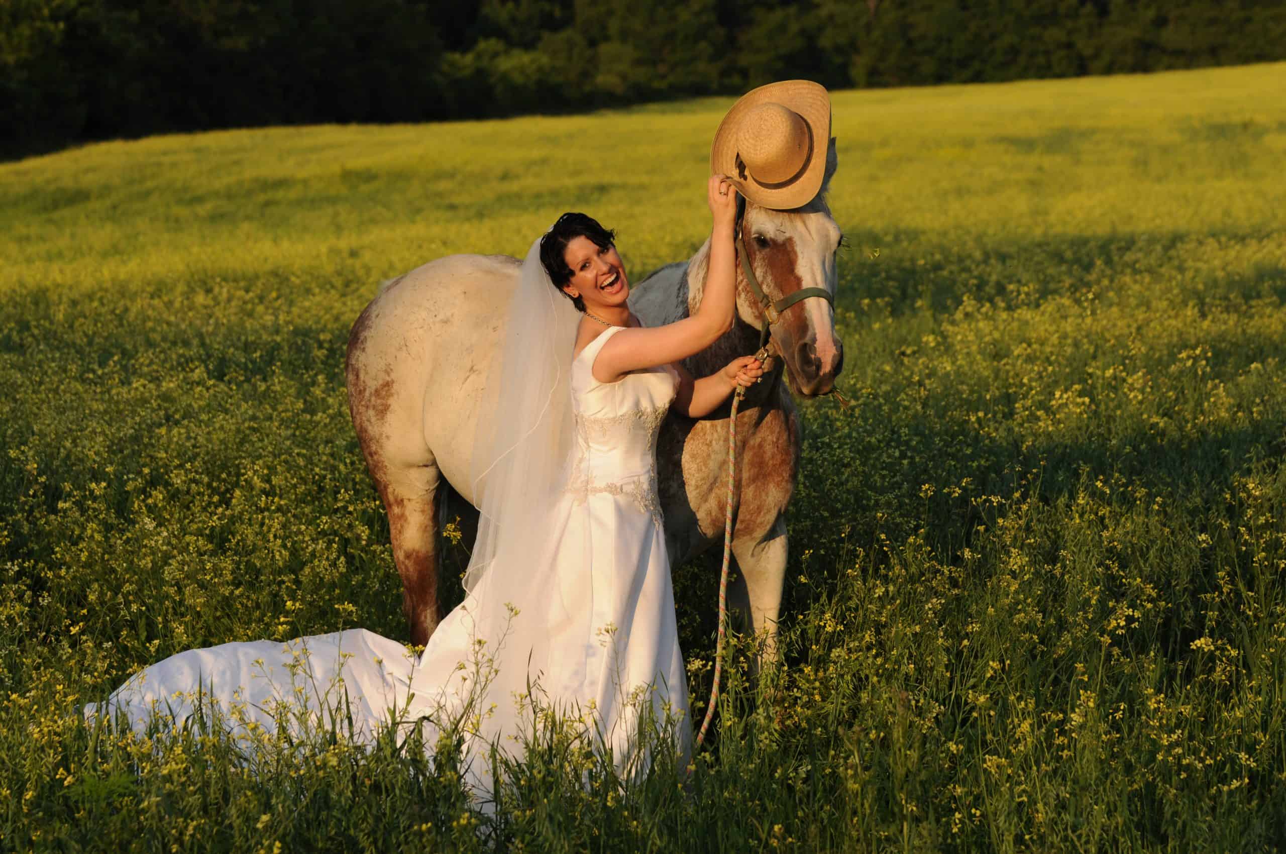Bride in Wedding Dress with horse at a farm