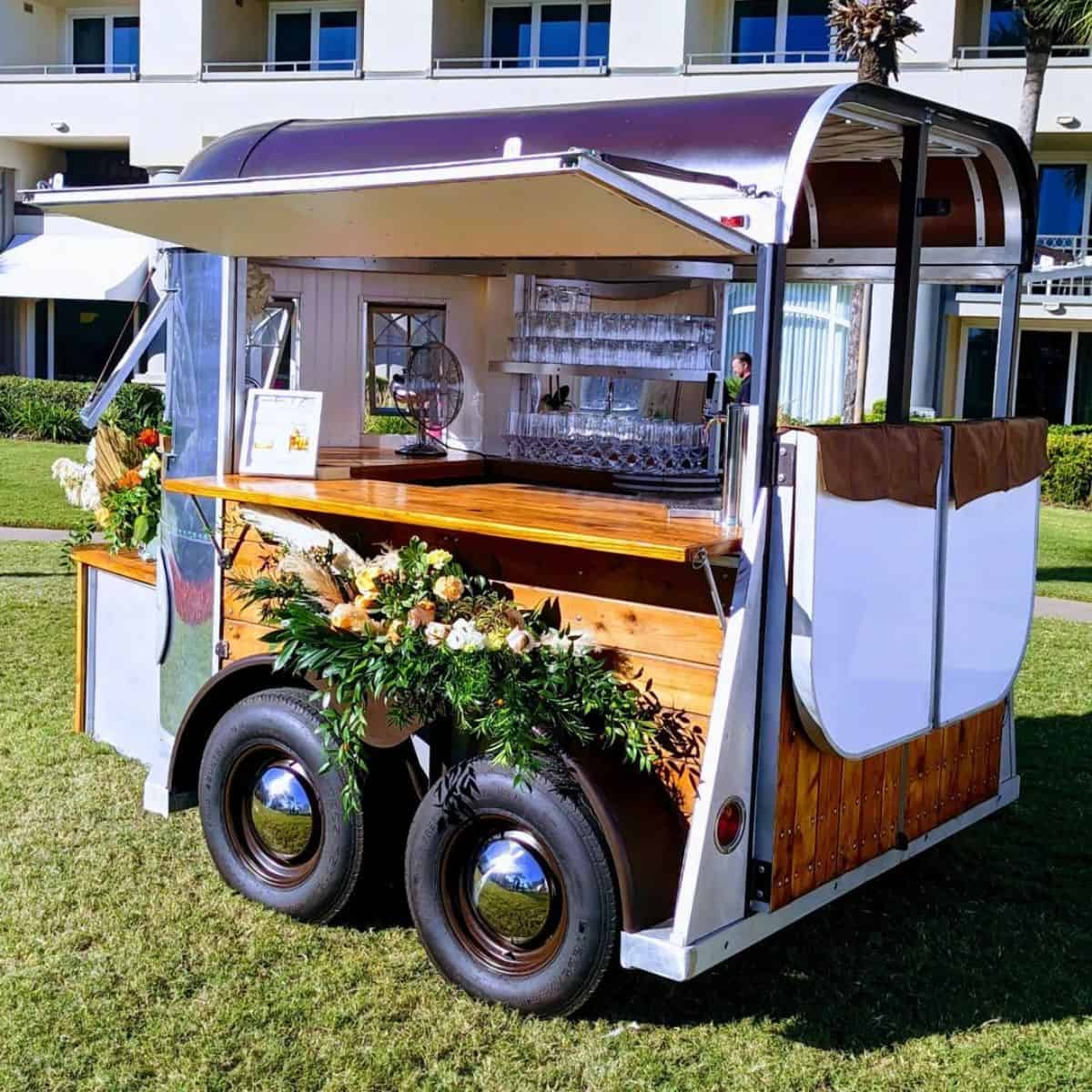 A rustic horse trailer rebuilded as a small bar.