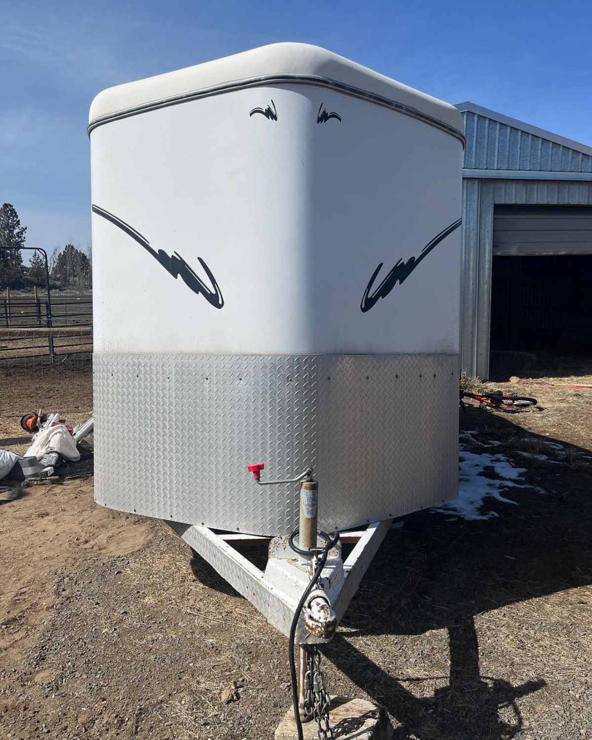 Horse trailer with initials.