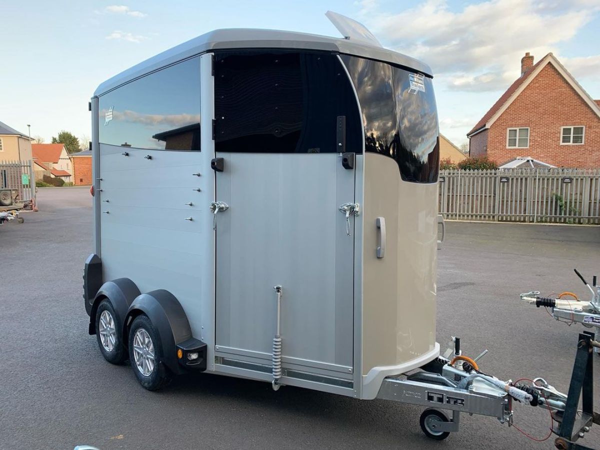 Black and white horse trailer.