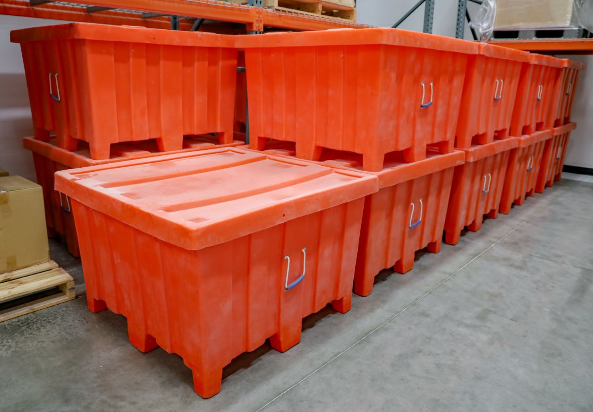 Orange plastic stackable containers.