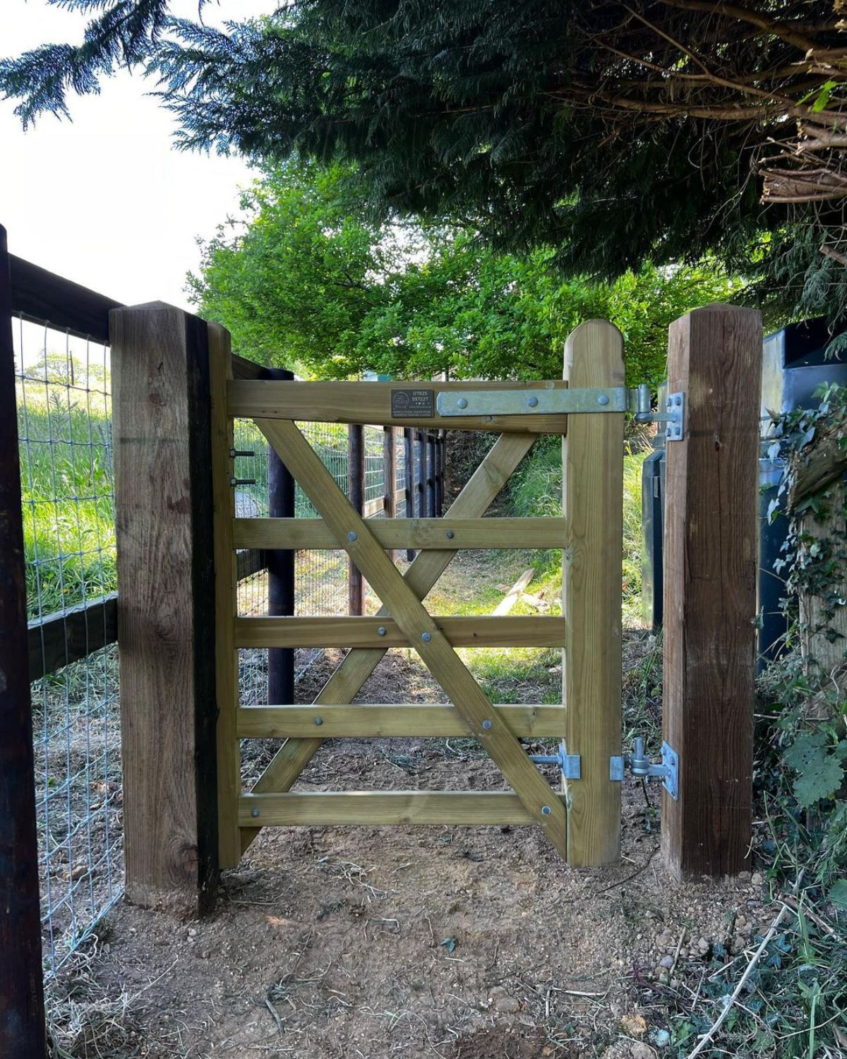 A wooden gate on a horse ranch.