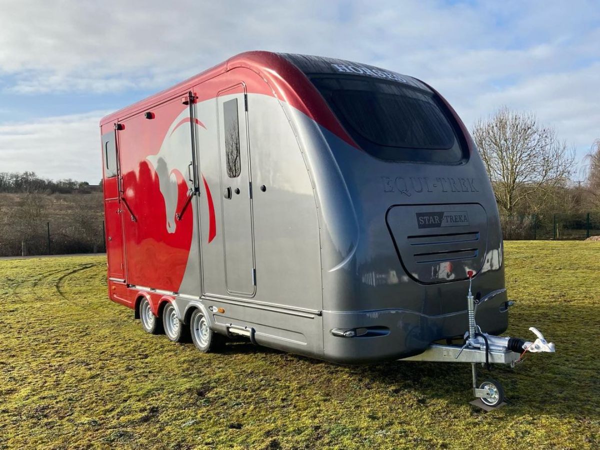Red-gray horse trailer.