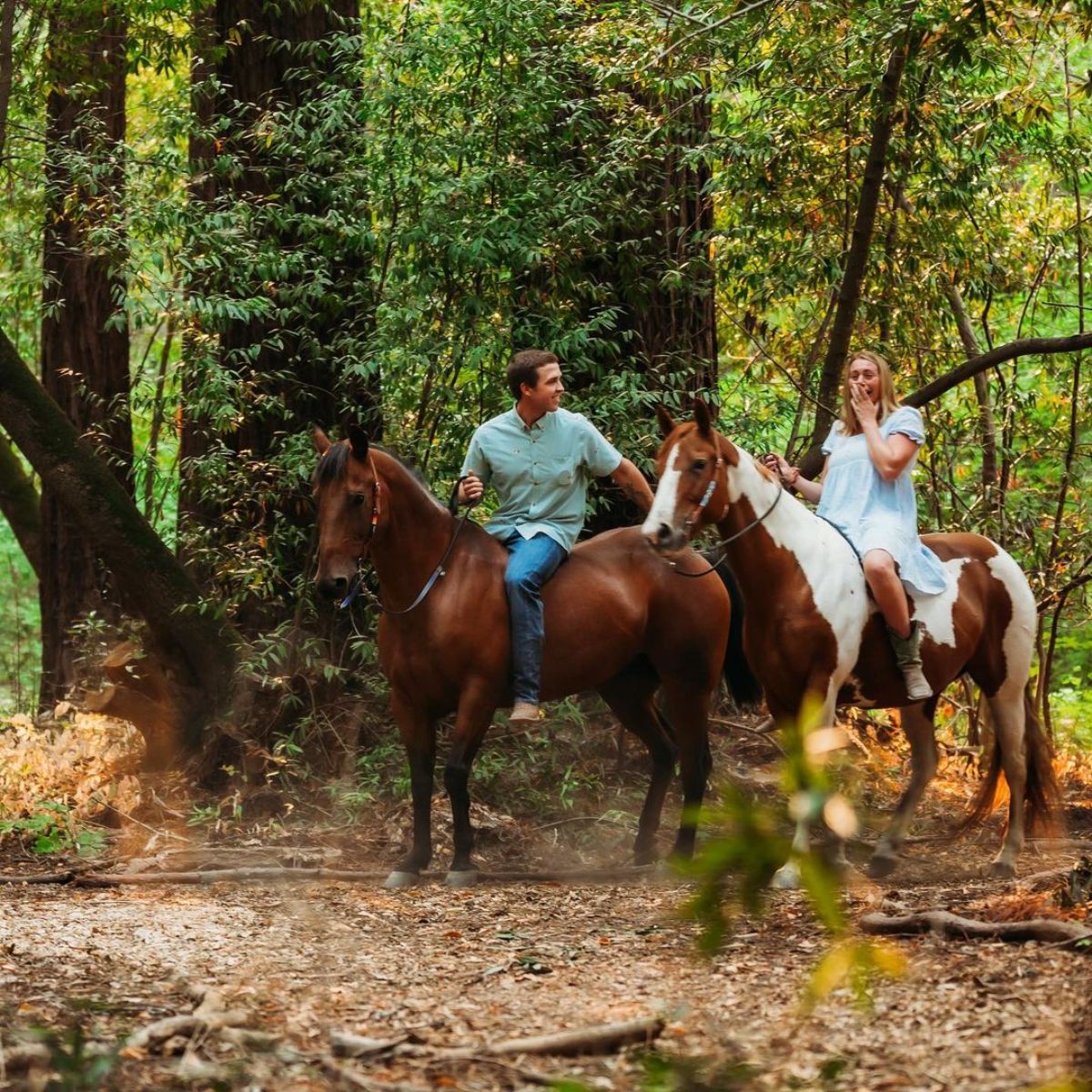 A young couple enjoying a horse ride.