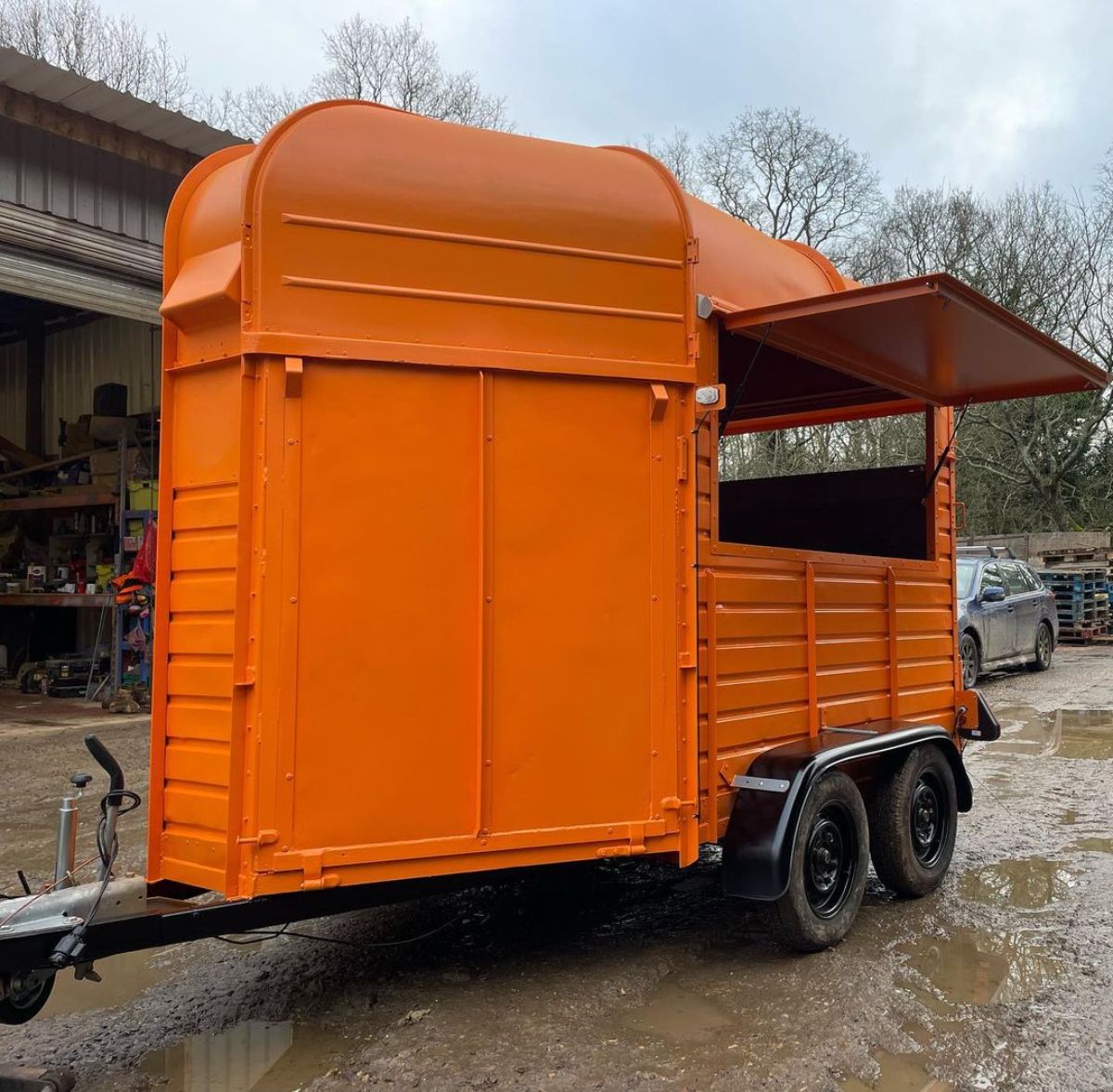 Orange horse trailer.